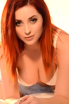 Redheaded Lucy Shows Her Big Tits